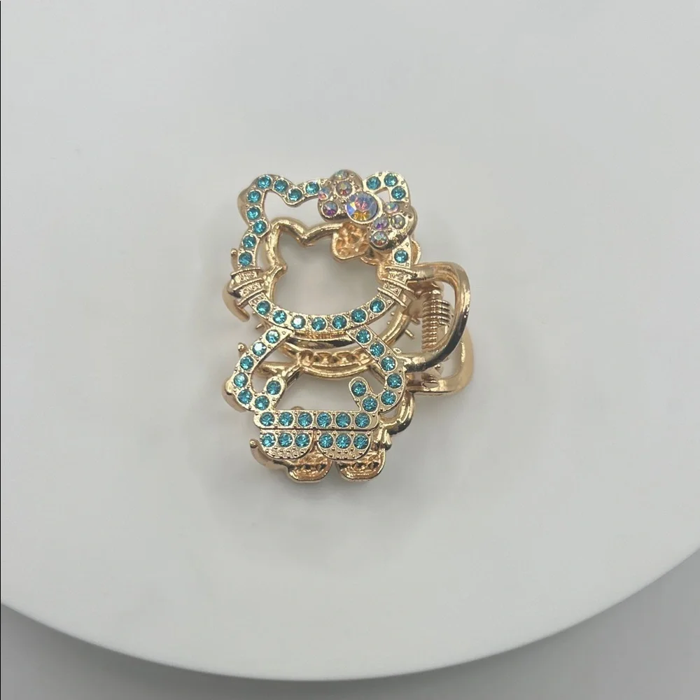 929. Gold and Blue Hello Kitty Hair Clip